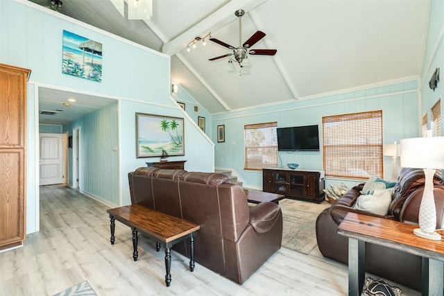 13022 Coronado Dr, Freeport, TX 77541 - living area with a ceiling fan, stairs, high vaulted ceiling, beamed ceiling, and light wood-style floors