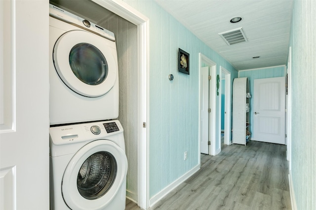 13022 Coronado Dr, Freeport, TX 77541 - laundry area with laundry area, stacked washer / dryer, visible vents, and light wood-style floors