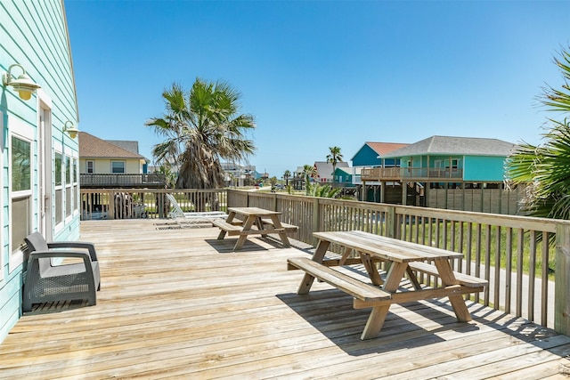 13022 Coronado Dr, Freeport, TX 77541 - wooden deck featuring a residential view