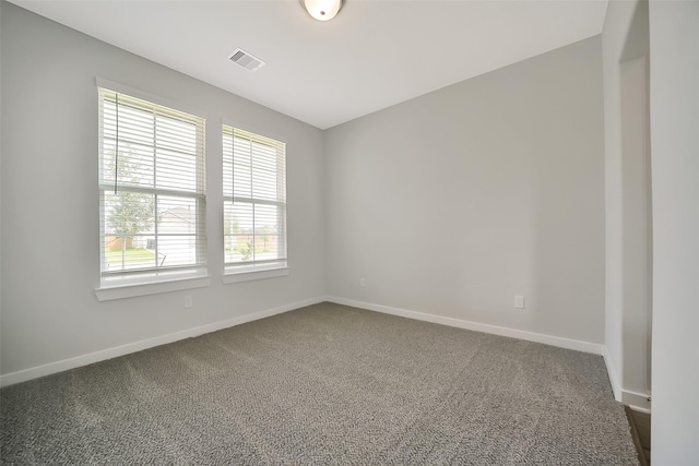 2563 Newport Breeze Dr, Katy, TX 77493 - unfurnished room with dark carpet and baseboards