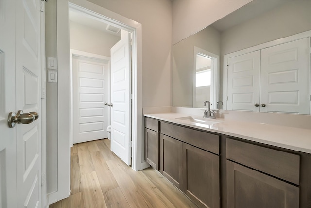 2563 Newport Breeze Dr, Katy, TX 77493 - bathroom with wood finished floors and vanity