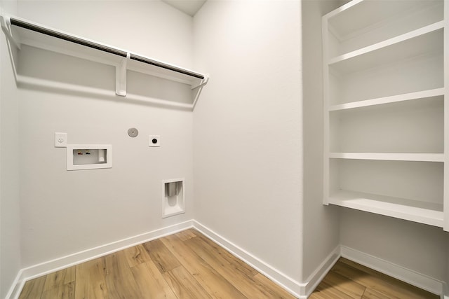 2563 Newport Breeze Dr, Katy, TX 77493 - laundry room featuring electric dryer hookup, hookup for a gas dryer, washer hookup, and baseboards
