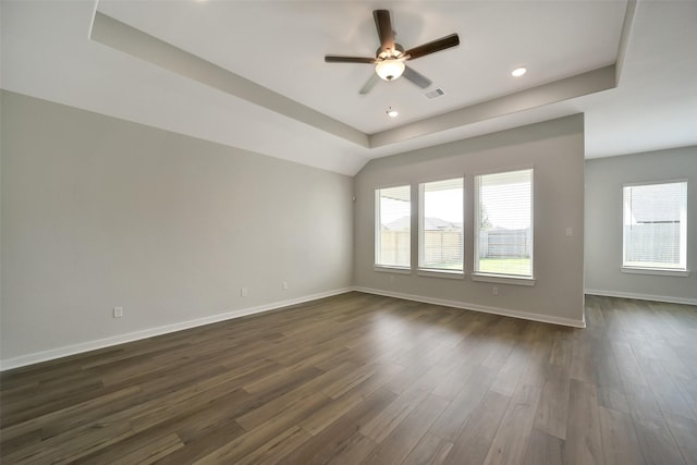 2563 Newport Breeze Dr, Katy, TX 77493 - unfurnished room with a ceiling fan, baseboards, dark wood-type flooring, recessed lighting, and a tray ceiling