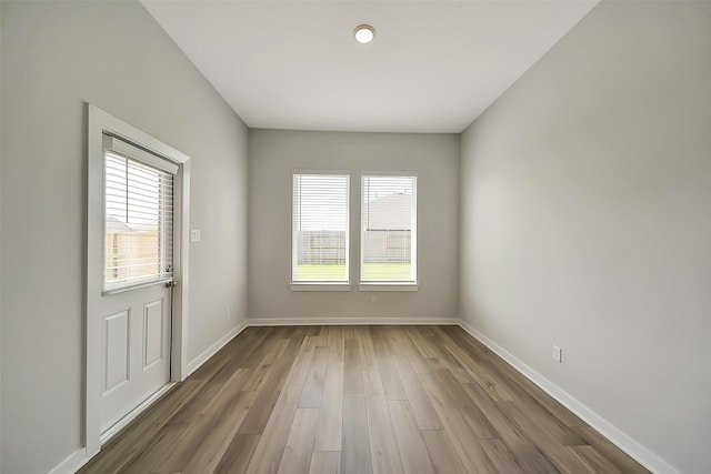 2563 Newport Breeze Dr, Katy, TX 77493 - spare room featuring plenty of natural light, wood finished floors, and baseboards