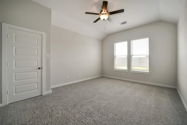 2563 Newport Breeze Dr, Katy, TX 77493 - empty room featuring lofted ceiling, ceiling fan, carpet, and baseboards