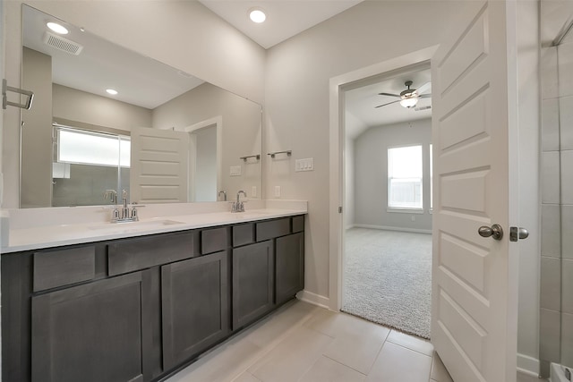 2563 Newport Breeze Dr, Katy, TX 77493 - bathroom with double vanity, a ceiling fan, tile patterned flooring, baseboards, and a shower with shower door