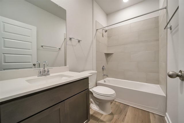 2563 Newport Breeze Dr, Katy, TX 77493 - bathroom featuring vanity, wood finished floors, washtub / shower combination, and toilet