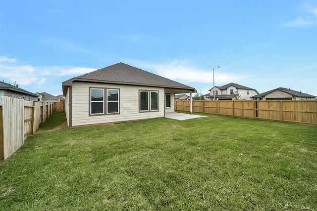 2563 Newport Breeze Dr, Katy, TX 77493 - rear view of property with a patio and a shingled roof