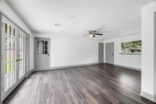 702 Pennington St, Houston, TX 77022 - unfurnished living room with french doors, wood finished floors, visible vents, a ceiling fan, and baseboards