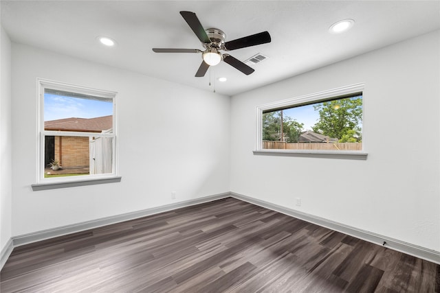 702 Pennington St, Houston, TX 77022 - unfurnished room with a ceiling fan, recessed lighting, visible vents, and dark wood-type flooring