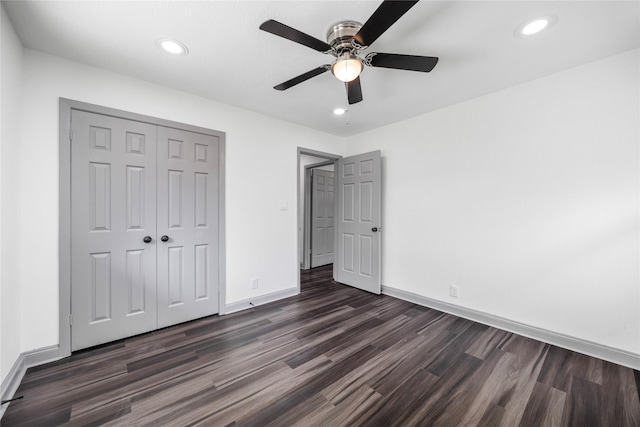 702 Pennington St, Houston, TX 77022 - unfurnished bedroom featuring baseboards, a closet, recessed lighting, and dark wood-type flooring