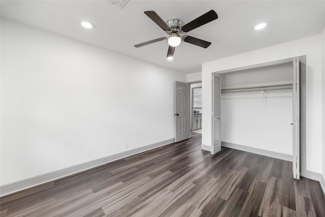 702 Pennington St, Houston, TX 77022 - unfurnished bedroom featuring dark wood-type flooring, baseboards, and recessed lighting
