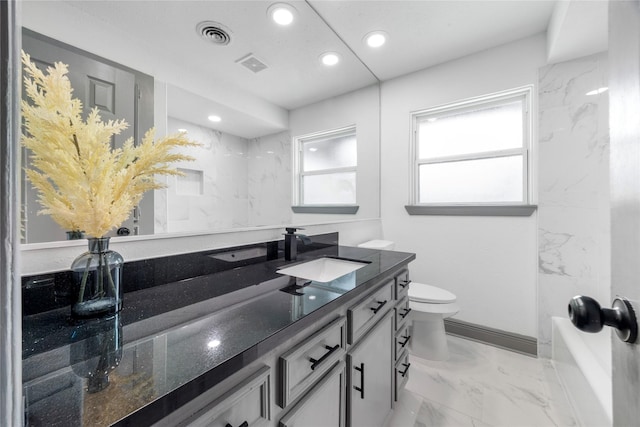 702 Pennington St, Houston, TX 77022 - full bathroom featuring recessed lighting, toilet, marble finish floor, visible vents, and vanity