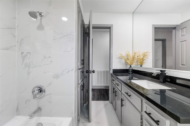 702 Pennington St, Houston, TX 77022 - full bathroom with visible vents, vanity, and washtub / shower combination