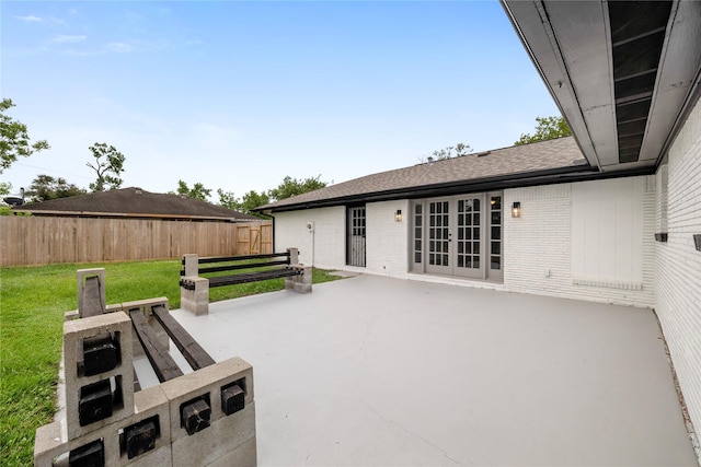 702 Pennington St, Houston, TX 77022 - view of patio / terrace featuring french doors and fence