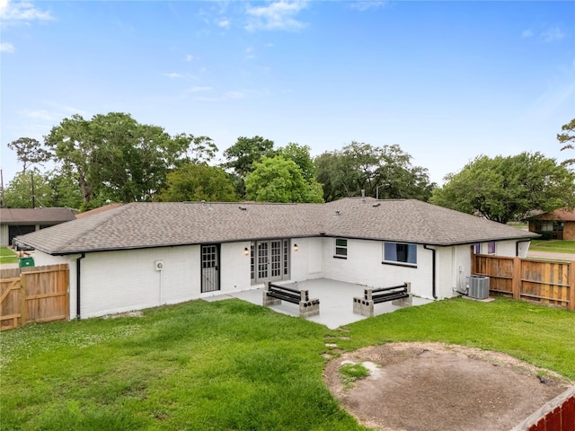 702 Pennington St, Houston, TX 77022 - back of house with central air condition unit, a patio area, french doors, and a fenced backyard