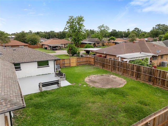 702 Pennington St, Houston, TX 77022 - view of yard with a residential view, a fenced backyard, and central AC