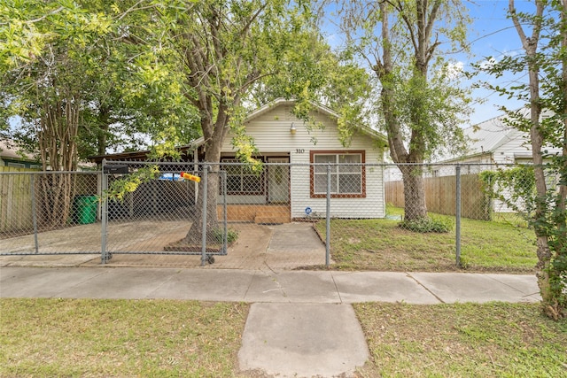 bungalow-style house featuring a fenced front yard, a gate, and a front yard