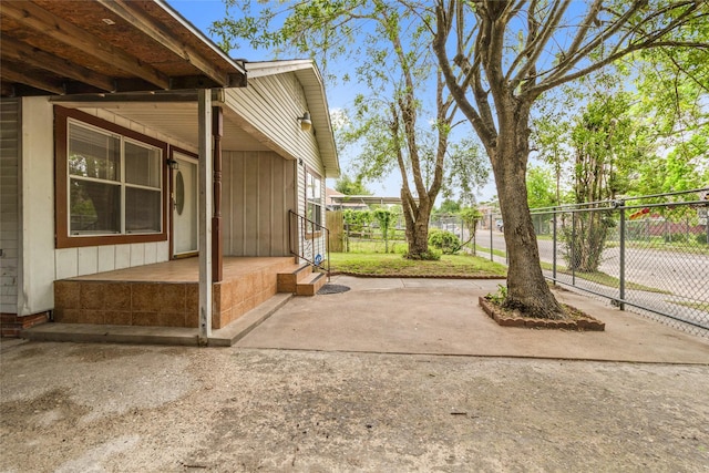 view of patio / terrace featuring fence