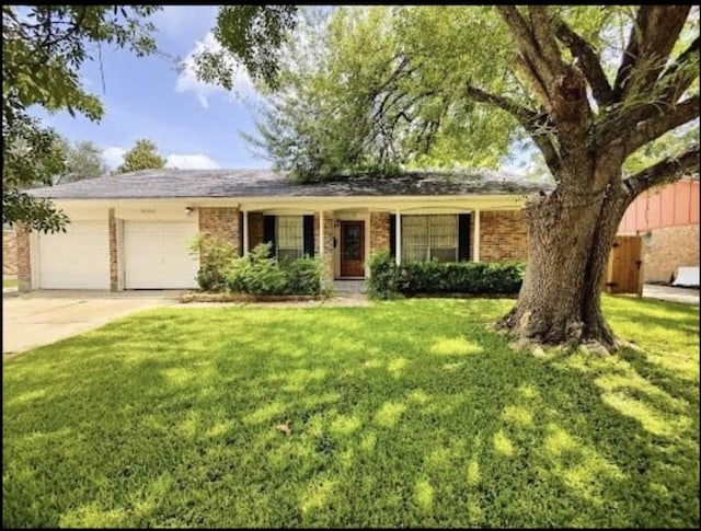 9006 Roos Rd, Houston, TX 77036 - ranch-style house featuring concrete driveway, a garage, brick siding, and a front yard