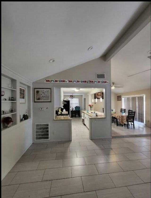 9006 Roos Rd, Houston, TX 77036 - interior space featuring visible vents, built in shelves, lofted ceiling, and ceiling fan