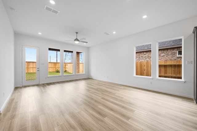 21818 Wycombe Terrace Way, Cypress, TX 77433 - empty room with light wood-style floors, a ceiling fan, recessed lighting, and baseboards