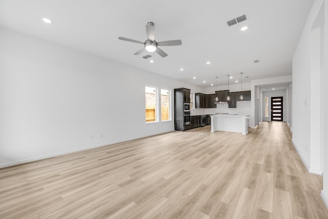 21818 Wycombe Terrace Way, Cypress, TX 77433 - unfurnished living room with ceiling fan, light wood finished floors, recessed lighting, and baseboards