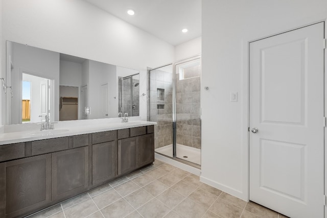 21818 Wycombe Terrace Way, Cypress, TX 77433 - bathroom with a stall shower, tile patterned floors, double vanity, recessed lighting, and baseboards