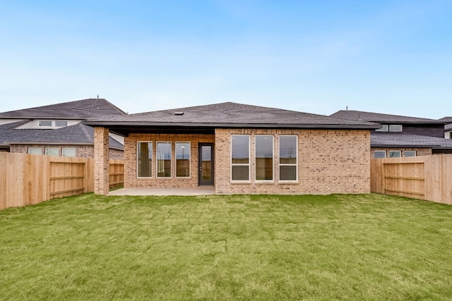 21818 Wycombe Terrace Way, Cypress, TX 77433 - rear view of house with a patio area, brick siding, and a shingled roof