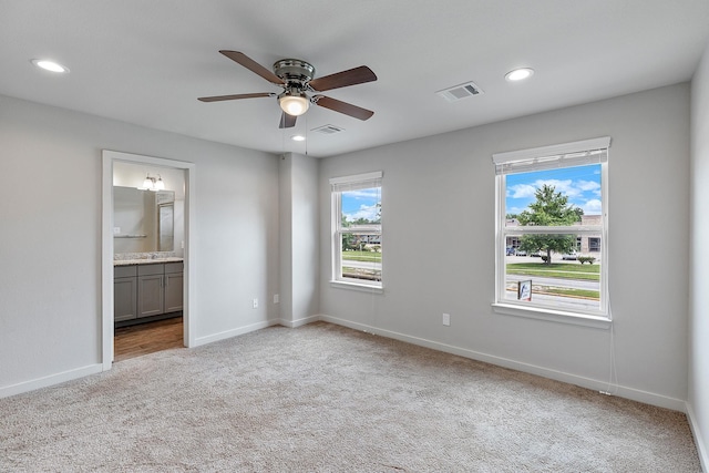 15010 Eagle Feather Ct, Houston, TX 77090 - unfurnished bedroom with carpet flooring, baseboards, visible vents, and recessed lighting