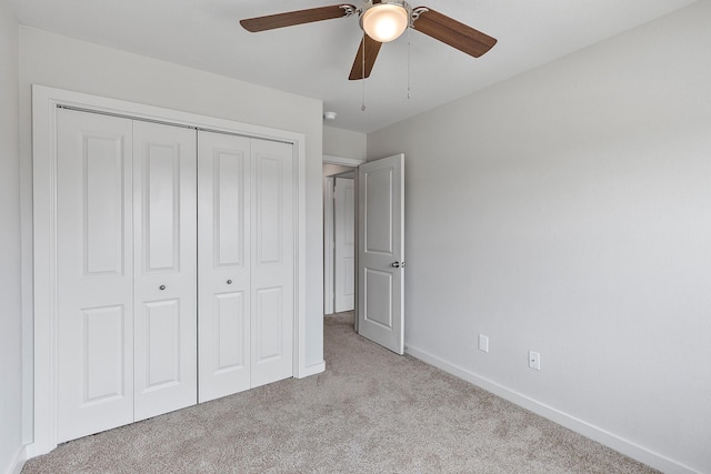 15010 Eagle Feather Ct, Houston, TX 77090 - unfurnished bedroom with baseboards, a closet, ceiling fan, and carpet floors