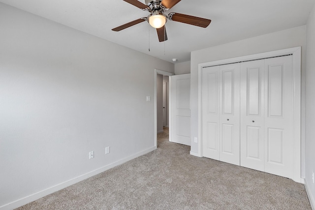 15010 Eagle Feather Ct, Houston, TX 77090 - unfurnished bedroom with carpet flooring, baseboards, a closet, and a ceiling fan