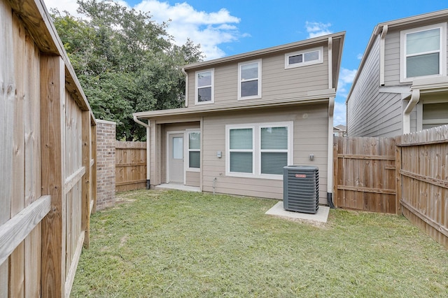 15010 Eagle Feather Ct, Houston, TX 77090 - rear view of house featuring a yard, cooling unit, and a fenced backyard