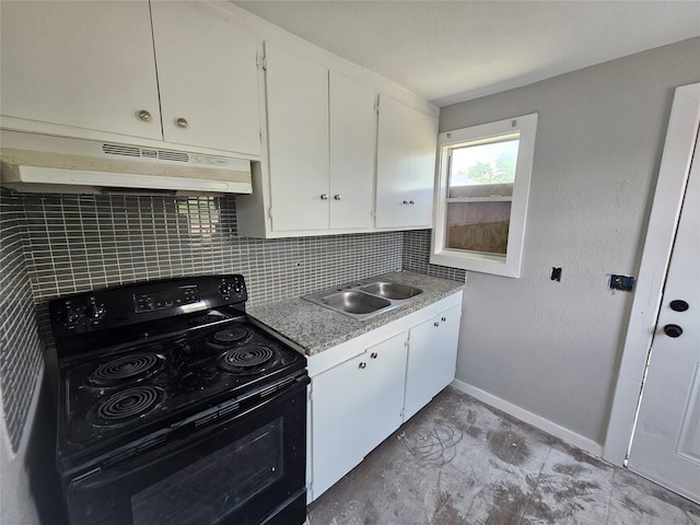 3229 Holman St Unit 4, Houston, TX 77004 - kitchen with black electric range, under cabinet range hood, a sink, baseboards, and white cabinets