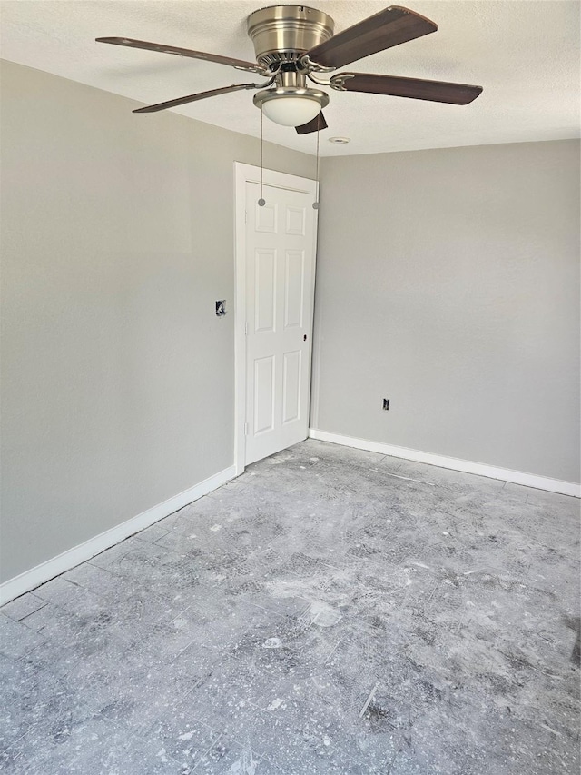 3229 Holman St Unit 4, Houston, TX 77004 - empty room with a ceiling fan, baseboards, concrete floors, and a textured ceiling