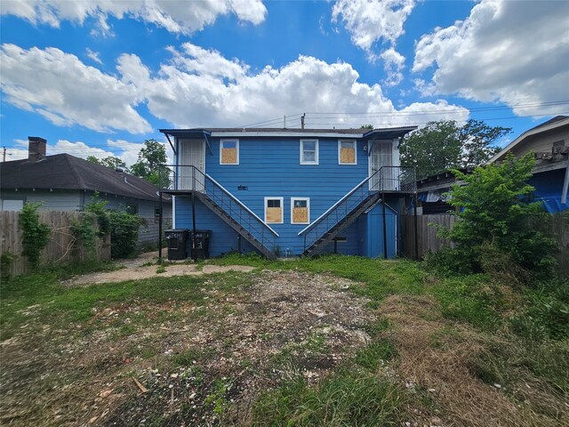 3229 Holman St Unit 4, Houston, TX 77004 - rear view of property with stairway and fence