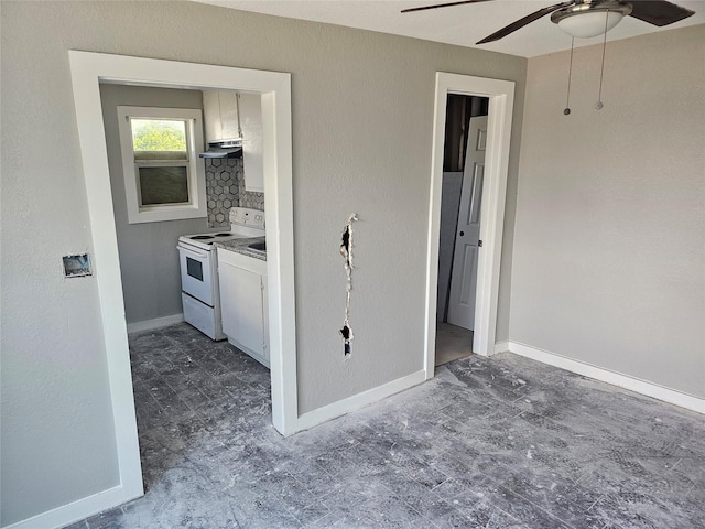 3229 Holman St Unit 4, Houston, TX 77004 - kitchen featuring electric stove, a ceiling fan, under cabinet range hood, baseboards, and white cabinets