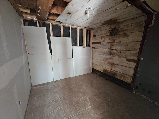 3229 Holman St Unit 4, Houston, TX 77004 - unfinished below grade area with wood walls and tile patterned flooring