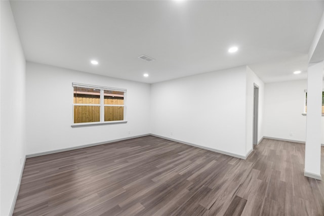 9211 Helmers St, Houston, TX 77022 - spare room featuring baseboards, recessed lighting, visible vents, and wood finished floors
