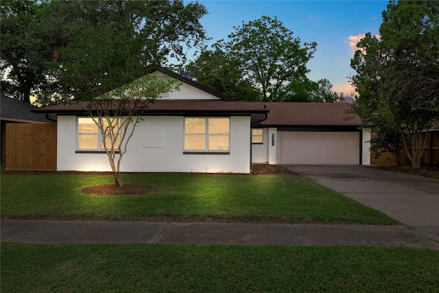 9211 Helmers St, Houston, TX 77022 - single story home with an attached garage, driveway, fence, and a front yard