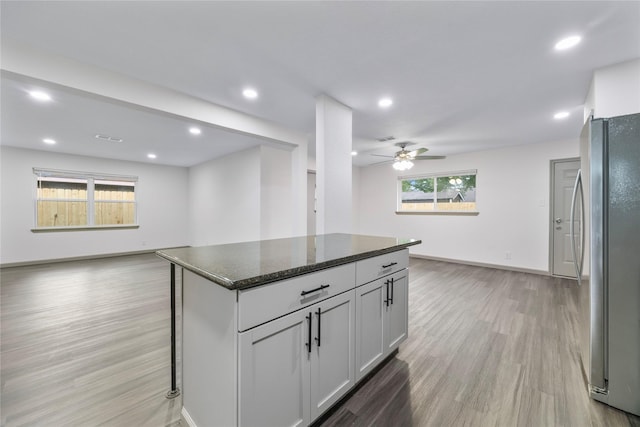 9211 Helmers St, Houston, TX 77022 - kitchen featuring freestanding refrigerator, light wood-type flooring, recessed lighting, open floor plan, and a ceiling fan