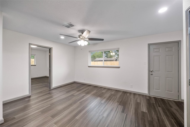 9211 Helmers St, Houston, TX 77022 - empty room featuring wood finished floors, visible vents, recessed lighting, ceiling fan, and baseboards