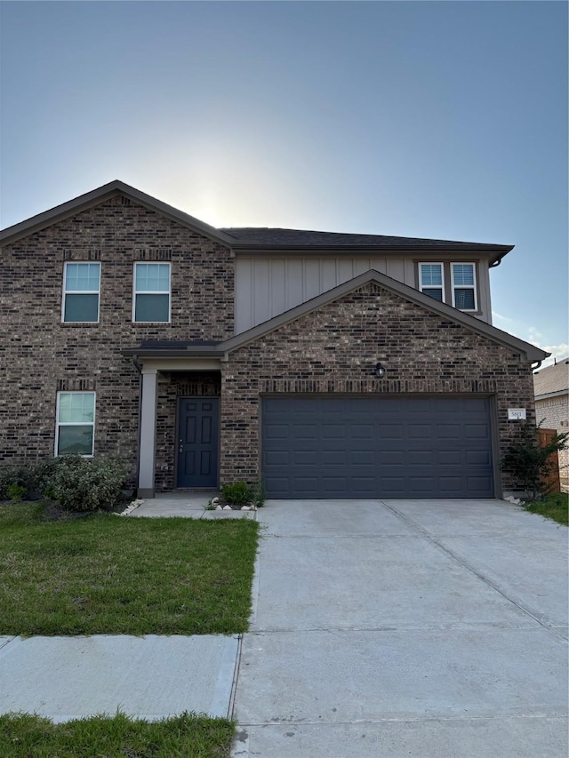 5811 Capri Forest Dr, Katy, TX 77493 - view of front of home with driveway, a garage, a front lawn, and brick siding
