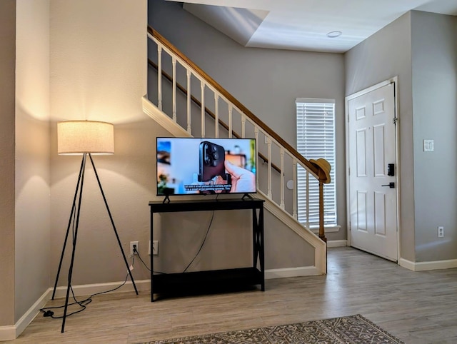 2626 Holly Hall St Unit 1201, Houston, TX 77054 - foyer entrance with wood finished floors, baseboards, and stairway