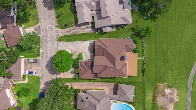 aerial view of property and surrounding area featuring a pool