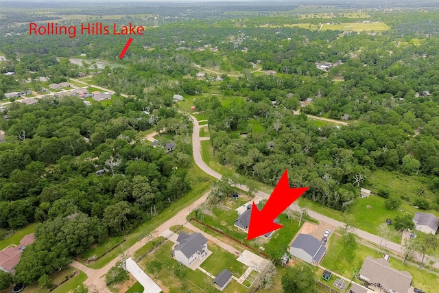 24585 Tipperary St, Hempstead, TX 77445 - drone / aerial view featuring a forest view