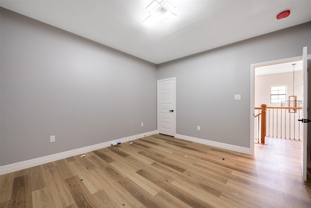 24585 Tipperary St, Hempstead, TX 77445 - unfurnished room with baseboards and light wood-style floors
