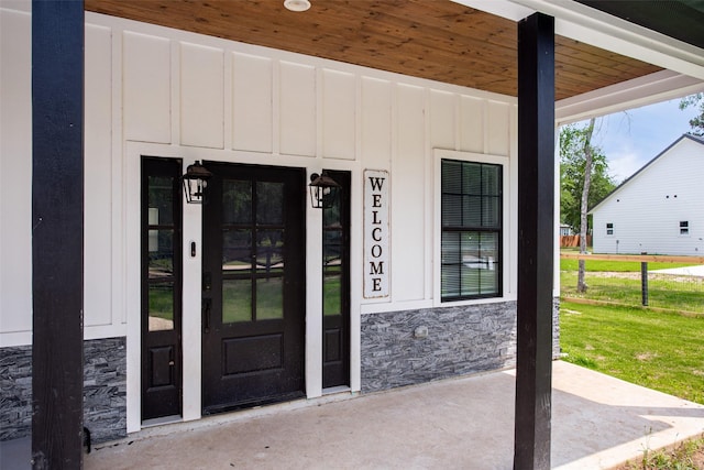 24585 Tipperary St, Hempstead, TX 77445 - property entrance with stone siding and board and batten siding