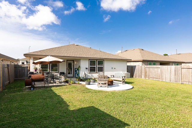 1830 William Scott St, Baytown, TX 77523 - rear view of house featuring a lawn, a patio area, a shingled roof, and a fenced backyard