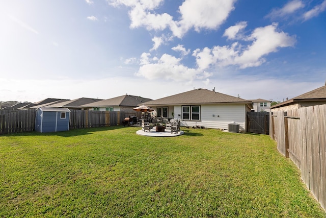 1830 William Scott St, Baytown, TX 77523 - back of house featuring a storage unit, a patio, an outbuilding, a fenced backyard, and central AC unit